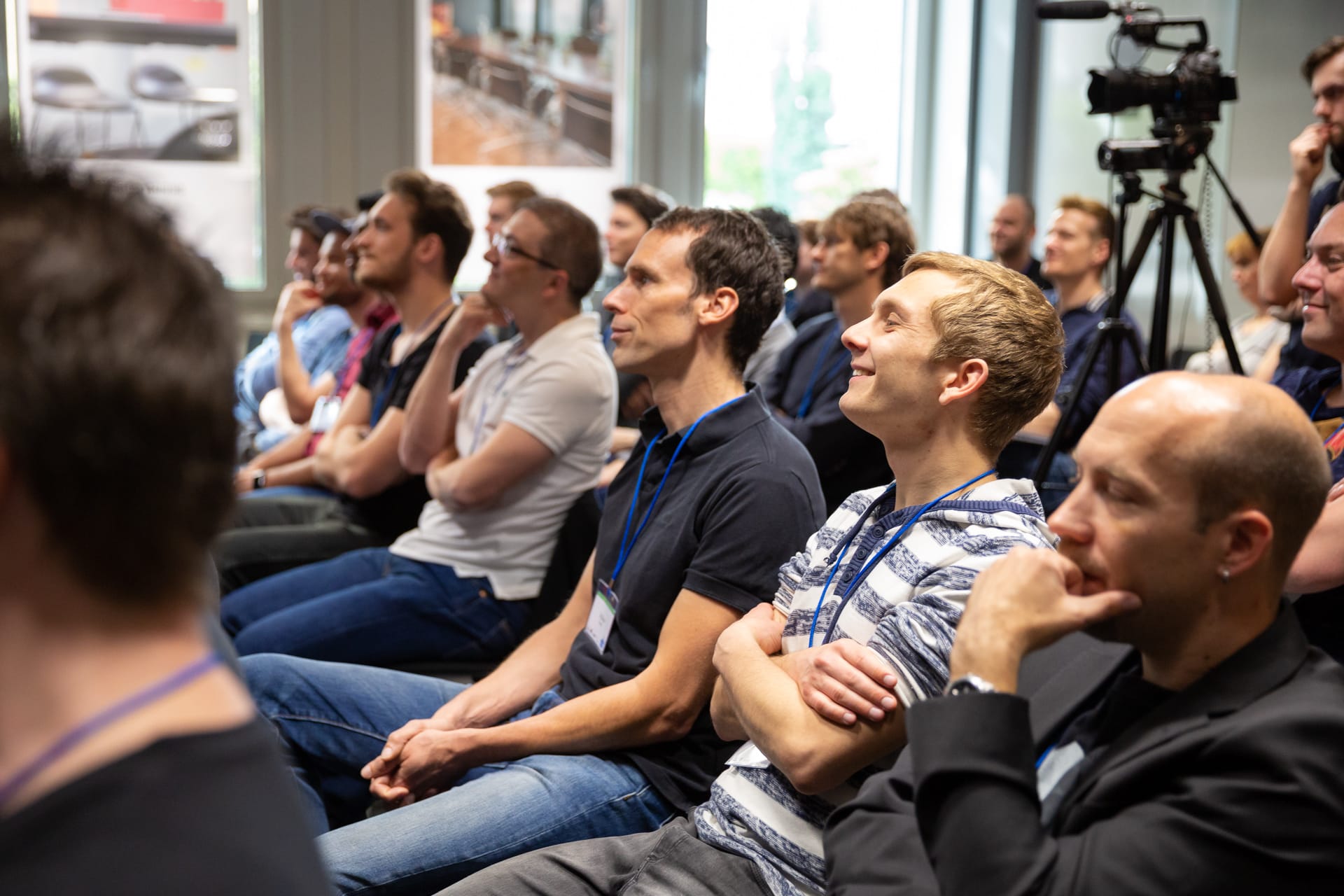 Lächelnde Gesichter unter den Zuhörern beim Umbraco-Festival Deutschland 2018